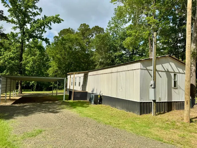 a backyard of a house with seating space