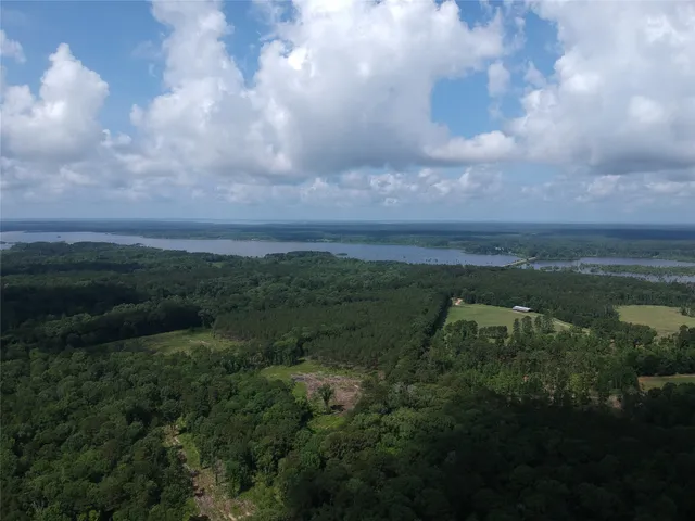 a view of a lake with a yard