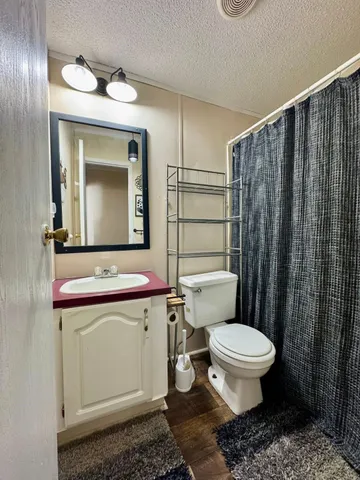 a bedroom with a bed and cabinets