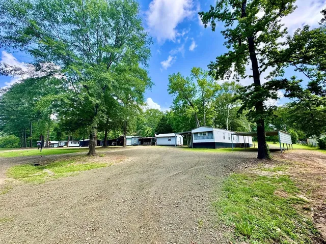 a swimming pool with a trees in the background