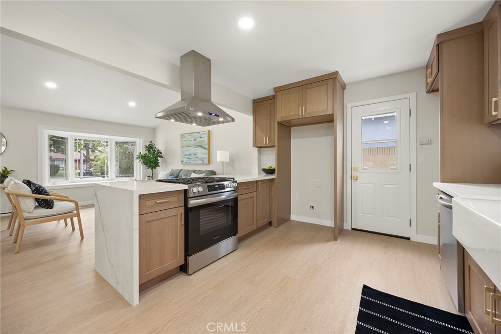 11524 Jerry Street Cerritos, CA 90703 - Photo 9 of 31 The kitchen is fresh and functional. It has been tastefully updated with new cabinets, quarts countertops and stainless steel appliances. New kitchen door leads to the side yard.
