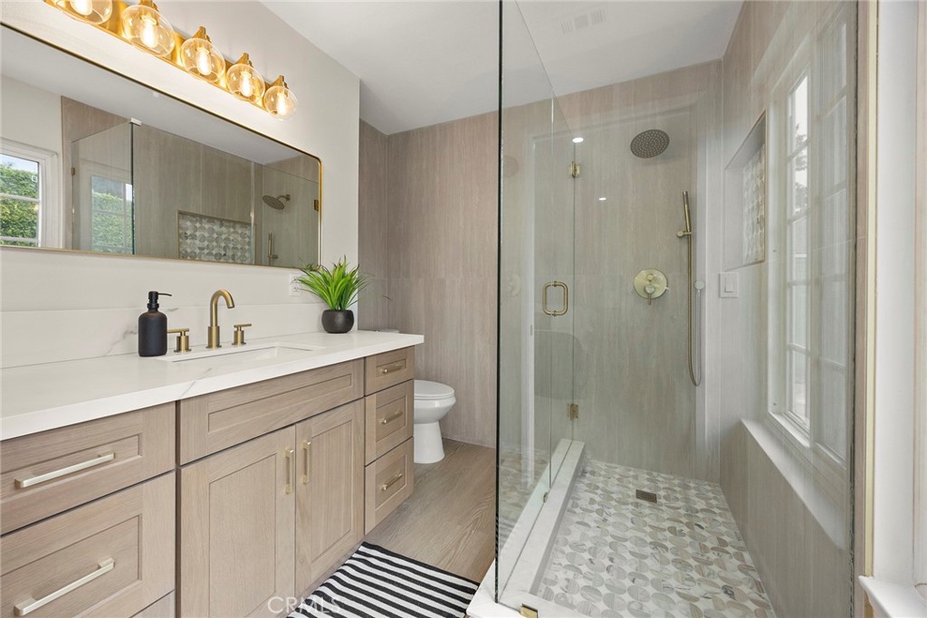 11524 Jerry Street Cerritos, CA 90703 - Photo 17 of 31 Primary bath is designed for a daily spa experience. Step into this beautiful shower with glass enclosure.