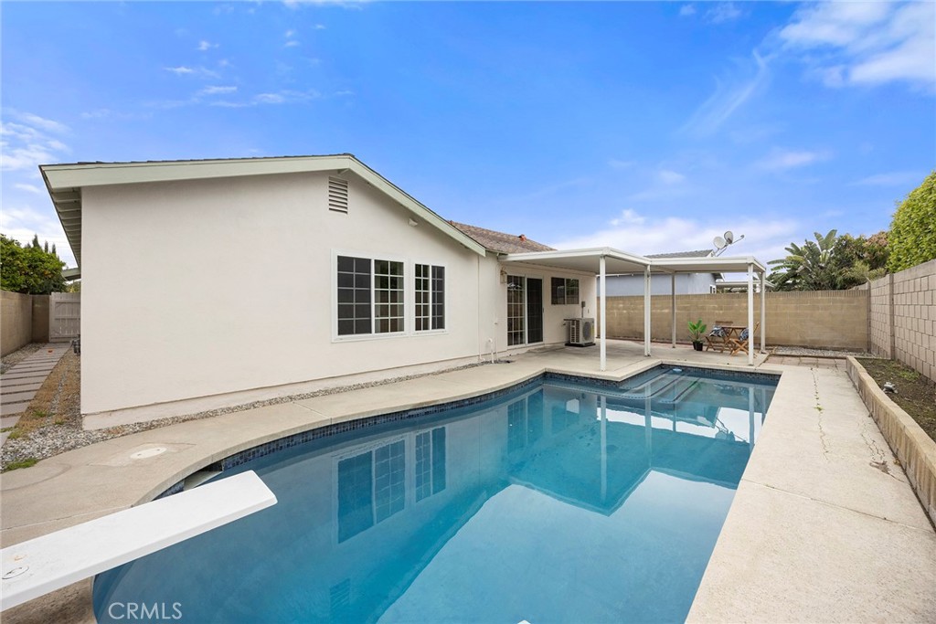 11524 Jerry Street Cerritos, CA 90703 - Photo 25 of 31 Step outside to a fully fenced backyard, offering privacy in the the outdoors.