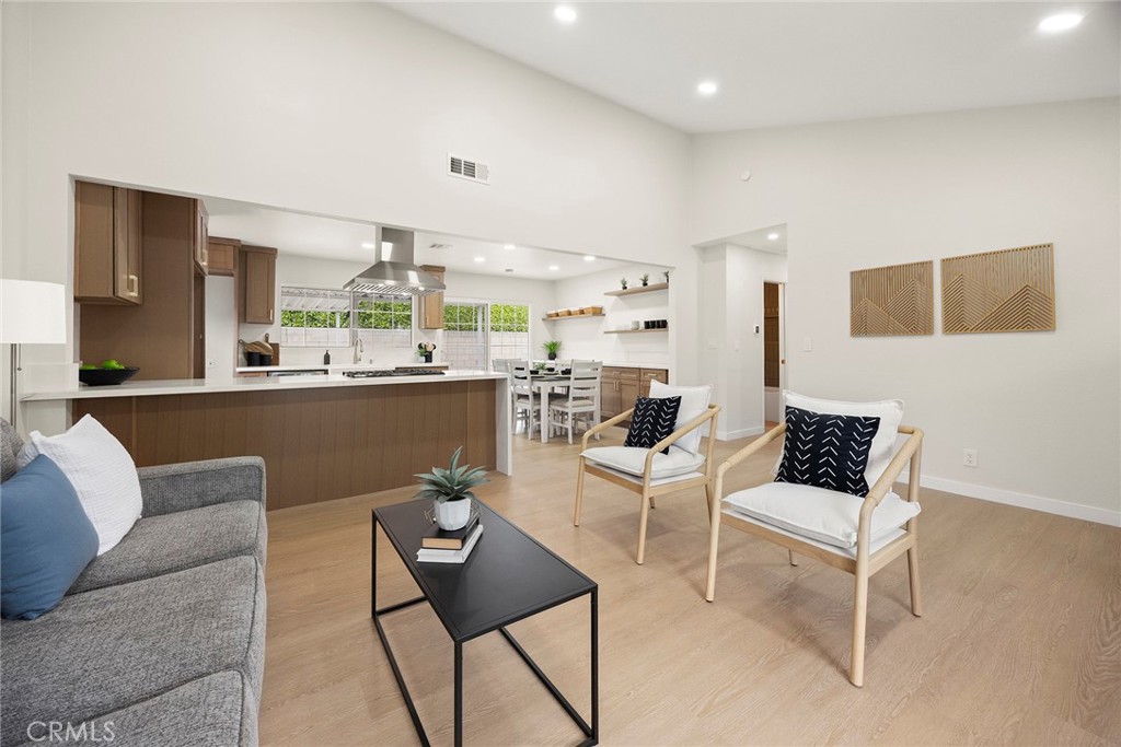 11524 Jerry Street Cerritos, CA 90703 - Photo 5 of 31 The great room encompasses a light-filled living room, dining area and kitchen.