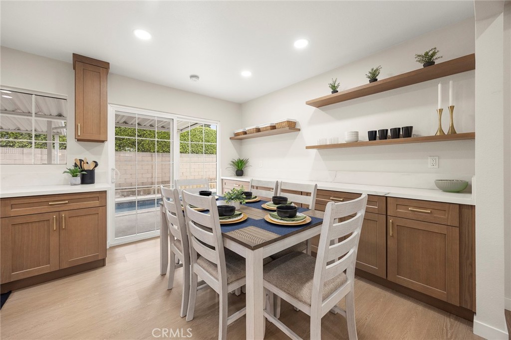 11524 Jerry Street Cerritos, CA 90703 - Photo 6 of 31 Sliding glass door in the kitchen and dining area beckon to a private backyard with a sparking pool and concrete patios.