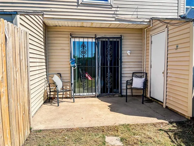 a view of living room filled with furniture and a rug