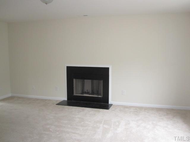 913 Roxy Street Raleigh, NC 27610 - Photo 3 of 6 a view of an empty room and wooden floor