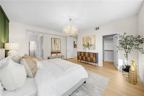 a living room with furniture wooden floor and a table