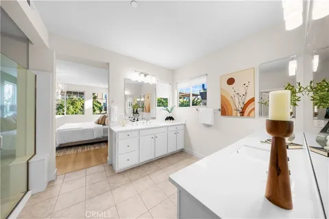 a living room with furniture a chandelier and a window
