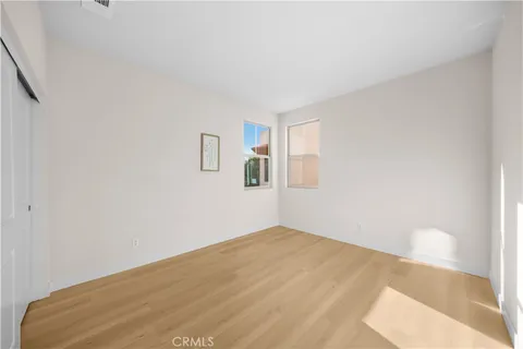 a view of a room with chairs and chandelier