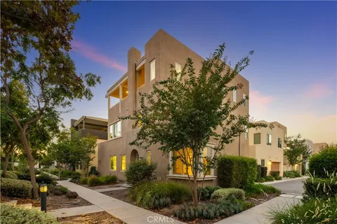 a row of palm trees and swimming pool on a patio