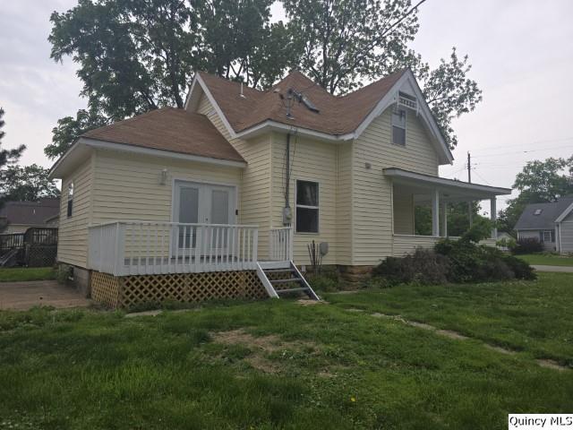 303 North Washington Street Carthage, IL 62321 - Photo 24 of 25 a view of a house with a yard and a large tree