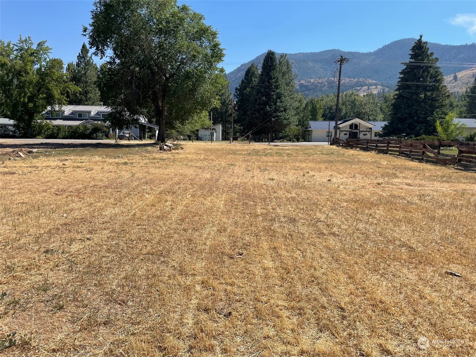 2-lot Riverside Avenue Twisp, WA 98856 - Photo 18 of 19 a view of swimming pool with a bench and trees in the background