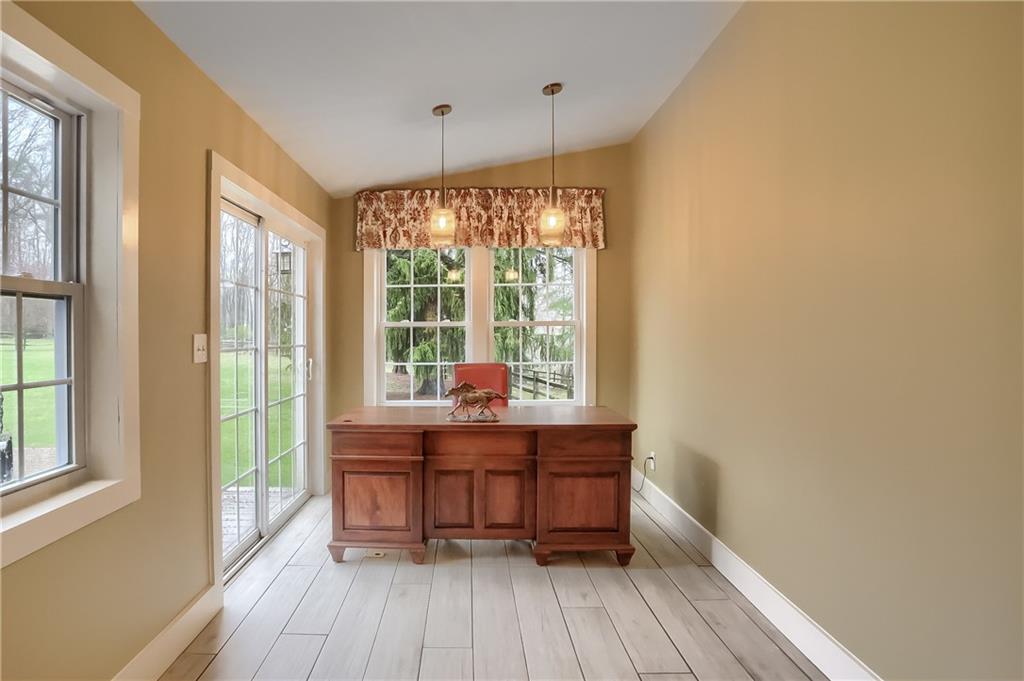 316 Denny Road Valencia, PA 16059 - Photo 17 of 49 Working from home will be a delight with the bright and airy home office featuring a vaulted ceiling and access to the exterior.