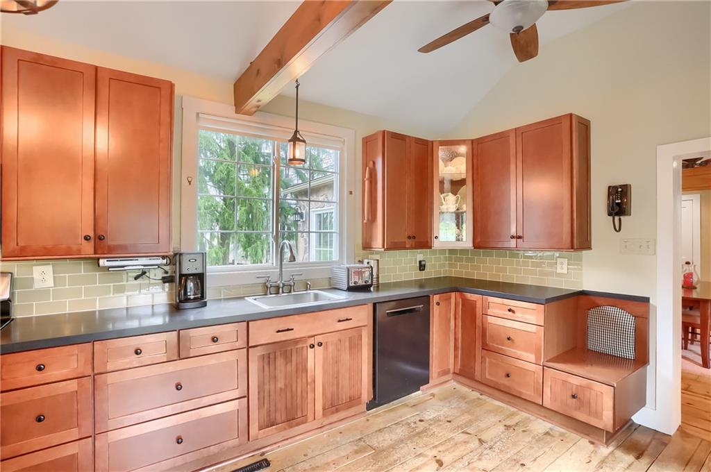 316 Denny Road Valencia, PA 16059 - Photo 8 of 49 Plenty of cabinetry for all your storage needs is highlighted with a showcase cabinet and bench seat.