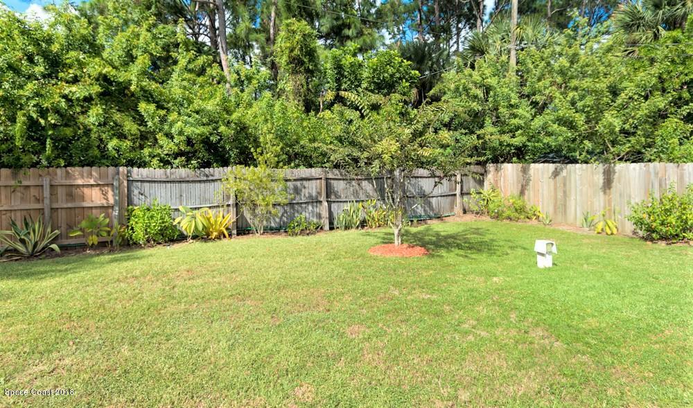 492 Warrington Road Southwest Palm Bay, FL 32908 - Photo 4 of 18 Large back yard with privacy fence.