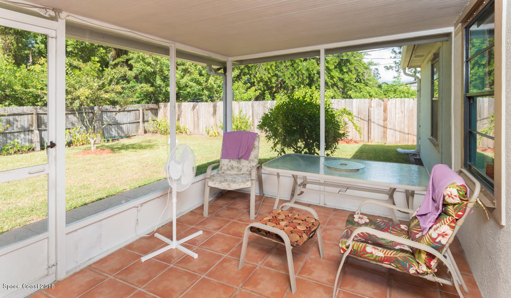 492 Warrington Road Southwest Palm Bay, FL 32908 - Photo 7 of 18 Large screened patio.