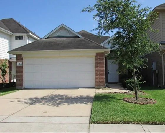 a front view of house with garden