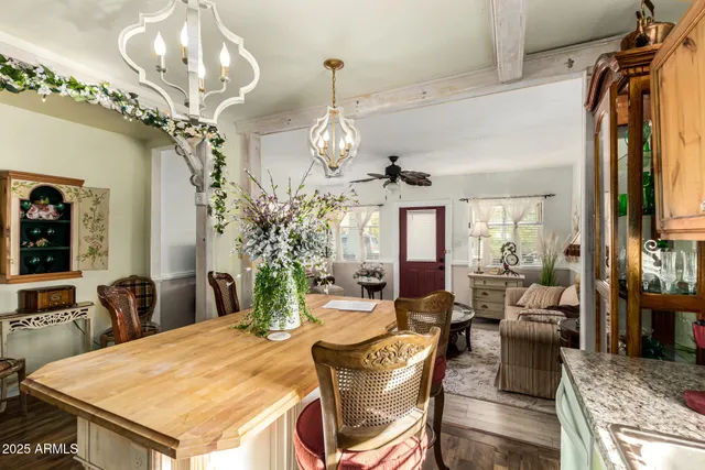 a view of a dining room with furniture wooden floor and chandelier