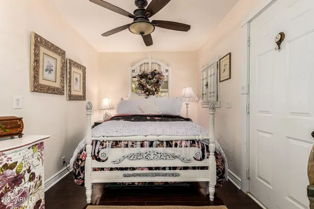 a view of a bedroom with a bed and a window