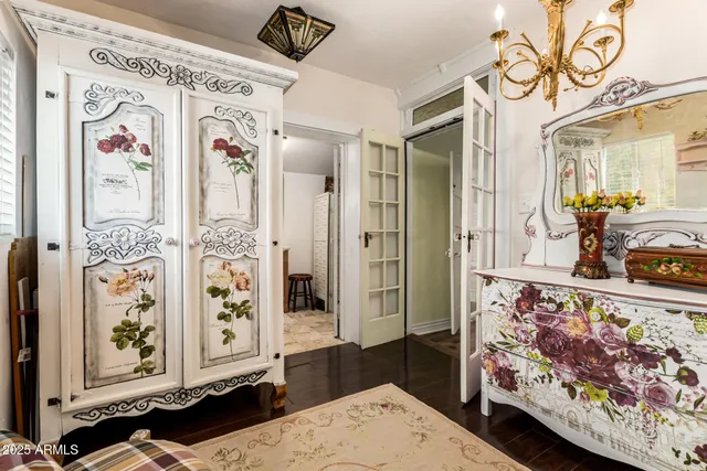 a view of bedroom with furniture and wooden floor
