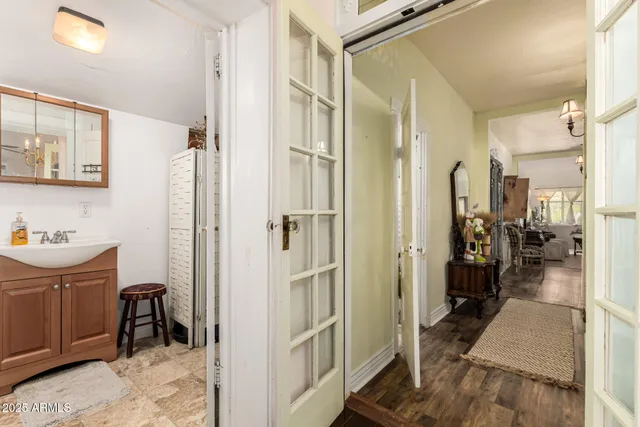 a bathroom with a tub sink and mirror