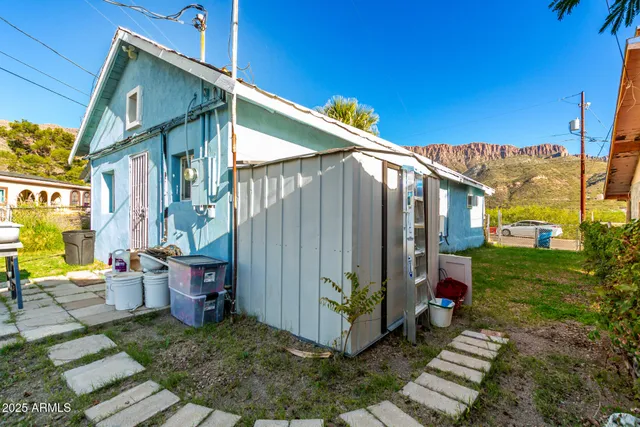 a backyard of a house with outdoor seating