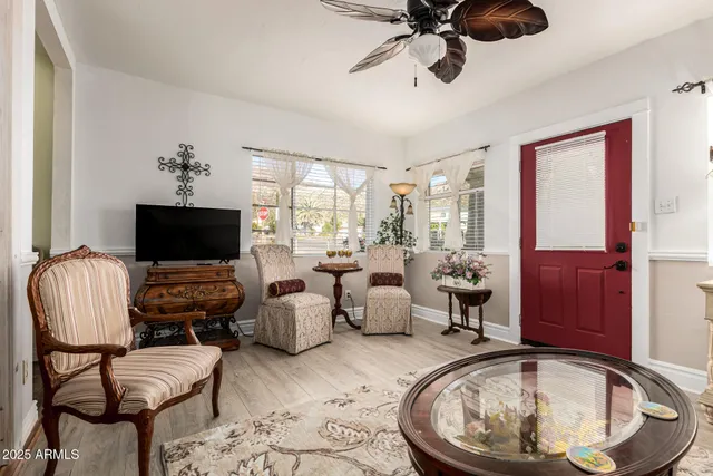 a living room with furniture and a flat screen tv