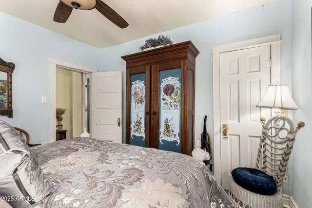 a bedroom with a bed and a chair