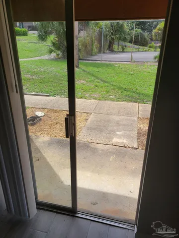 a view of a room with a large window