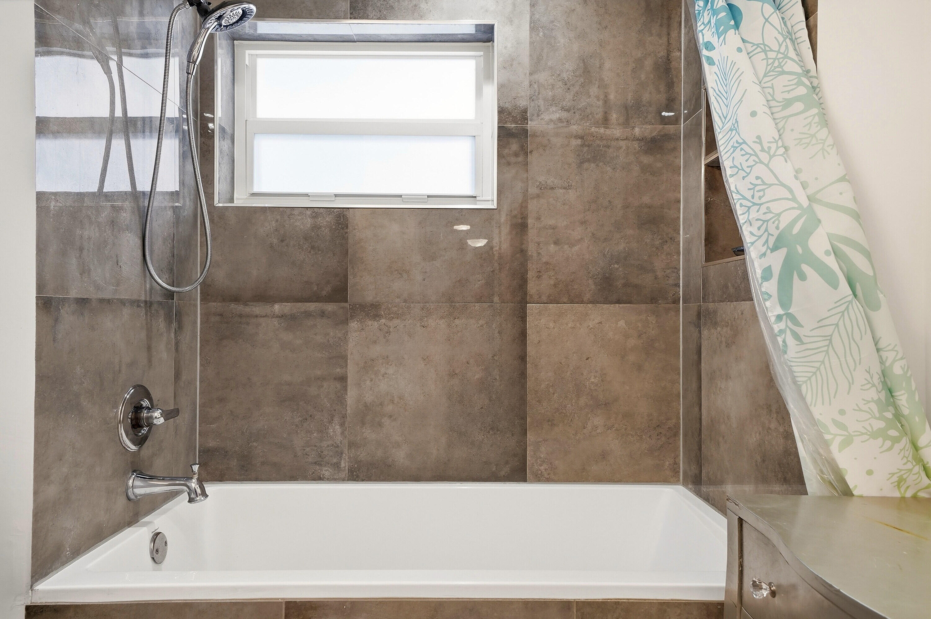 3510 Harrison Street, Unit 4 Hollywood, FL 33021 - Photo 15 of 31 a bathroom with a bathtub and a shower