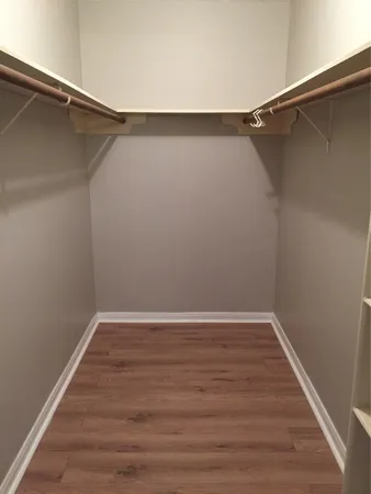 a view of an empty walk in closet