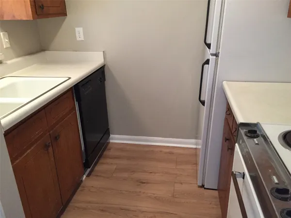 a kitchen with a stove and a refrigerator