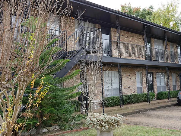a view of a building with a tree
