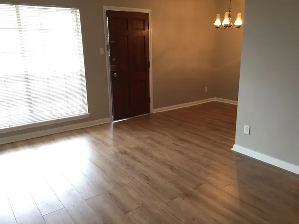 a view of a livingroom with wooden floor