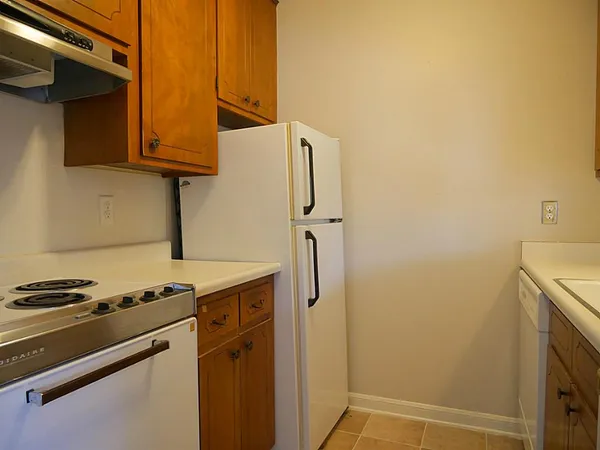a kitchen with a sink stove and refrigerator