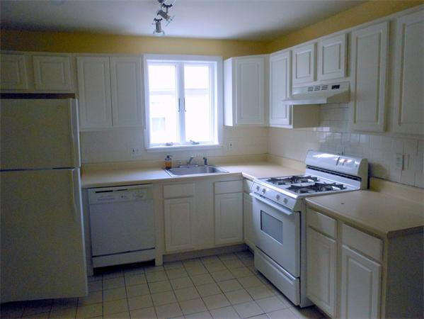27-29 Dufton Road Andover, MA 01810 - Photo 7 of 12 a kitchen with cabinets appliances and a window