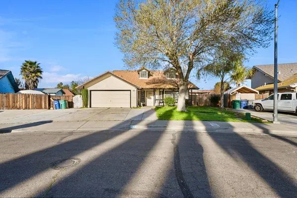 a view of house with yard