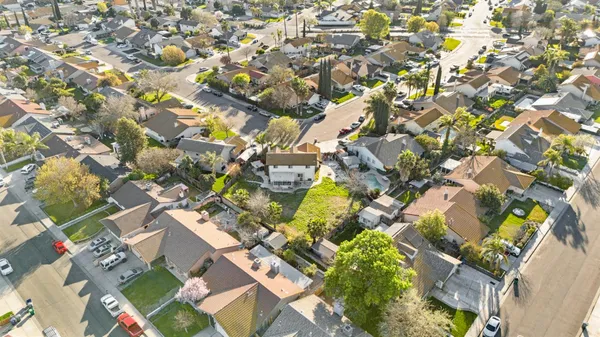 an aerial view of residential houses with outdoor space