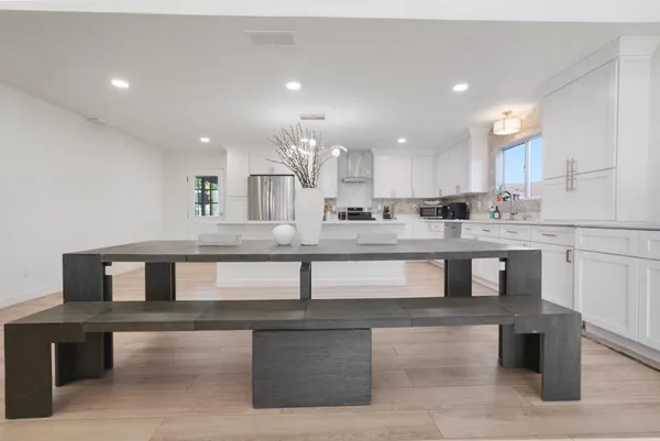 a kitchen with kitchen island cabinets and a sink