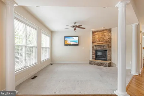 a bath tub sitting next to a white toilet
