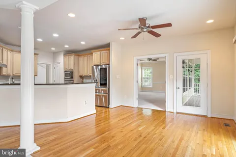 a kitchen with granite countertop cabinets and black appliances