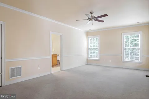 a view of a deck with furniture and trees