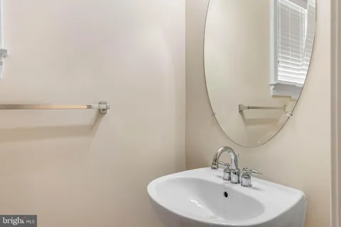 an aerial view of residential houses with outdoor space and swimming pool