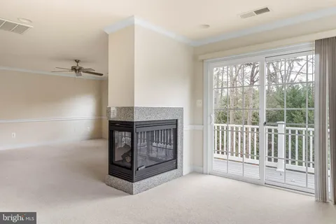 a view of living room with furniture and a large window