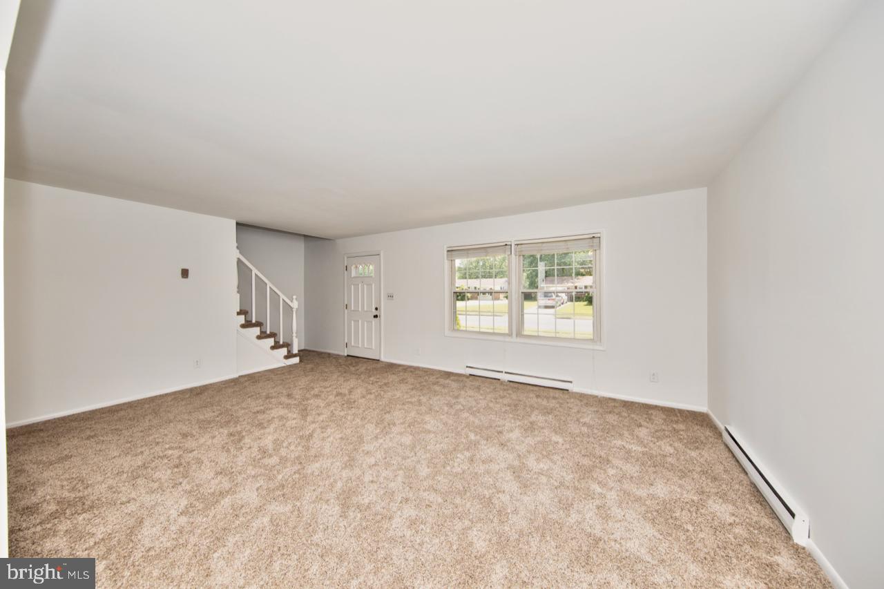 807 Falconer Road Joppa, MD 21085 - Photo 4 of 22 Large living room with new carpet