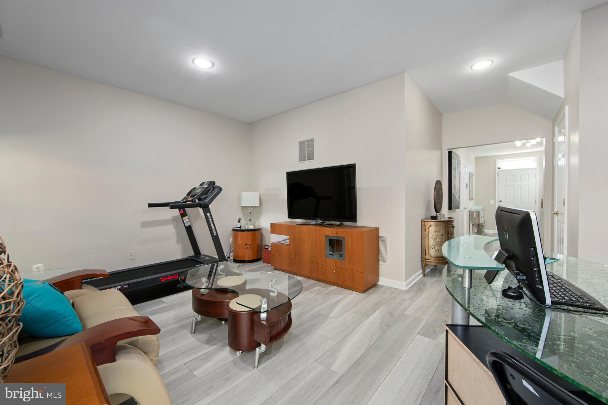 27 Firethorn Lane Riverside, NJ 08075 - Photo 11 of 43 a living room with furniture flat screen tv and a wooden floor
