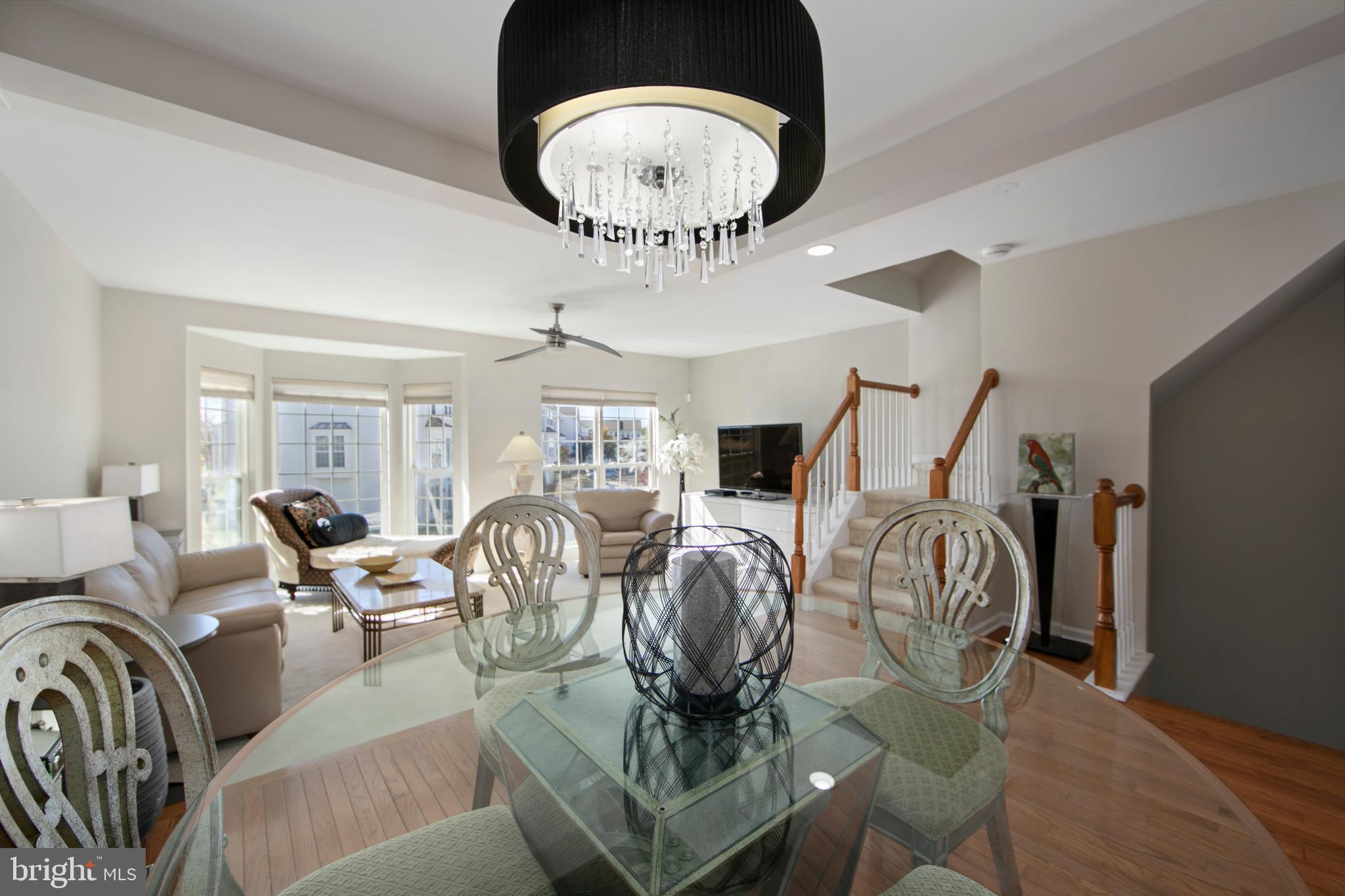 27 Firethorn Lane Riverside, NJ 08075 - Photo 14 of 43 a living room with furniture a chandelier and a rug
