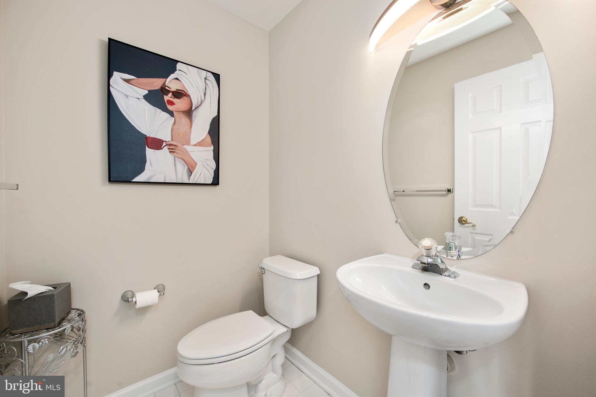 27 Firethorn Lane Riverside, NJ 08075 - Photo 16 of 43 a bathroom with a toilet sink and mirror