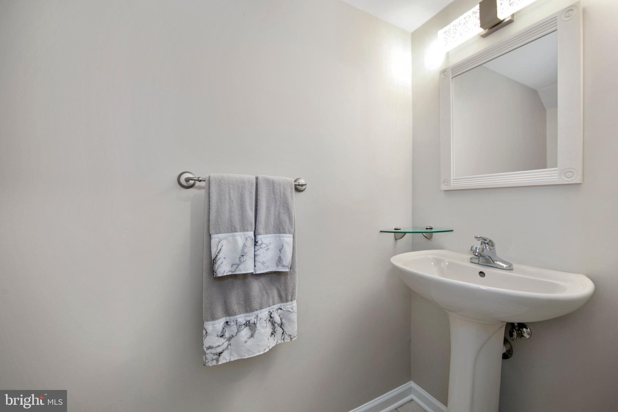 27 Firethorn Lane Riverside, NJ 08075 - Photo 17 of 43 a bathroom with a sink and a mirror